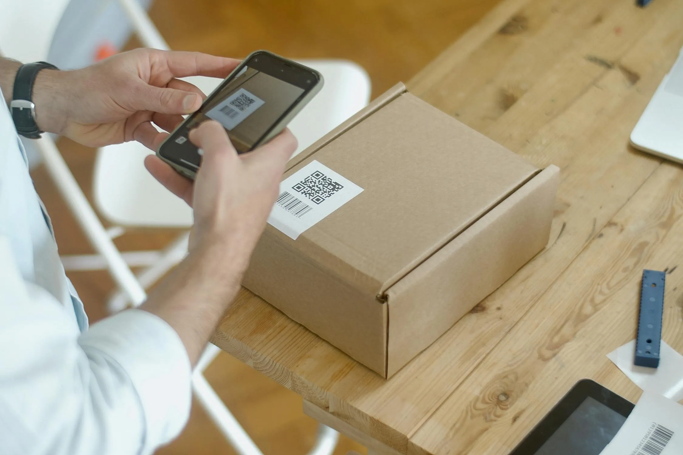 Person using a smartphone to scan and verify a product code