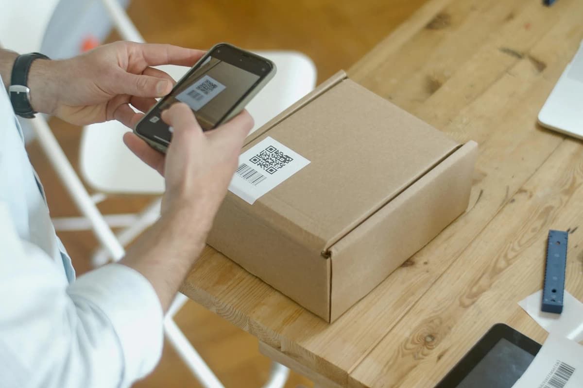 Person using a smartphone to scan and verify a product code