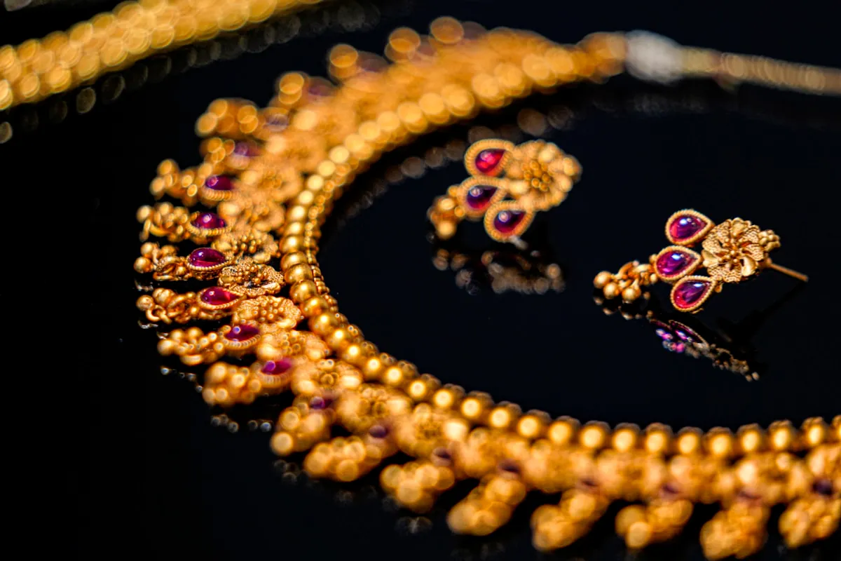 Gold jewellery displayed in a retail store showcase